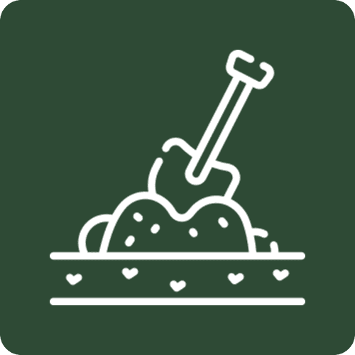 Shovel in decorative planter filled with soil
