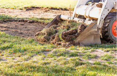 Lawn maintenance with heavy equipment